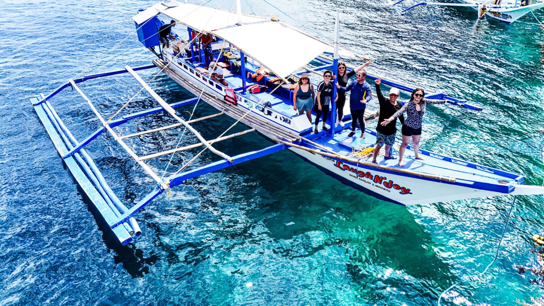 Life vests and snorkeling gear on a tour boat deck, El Nido