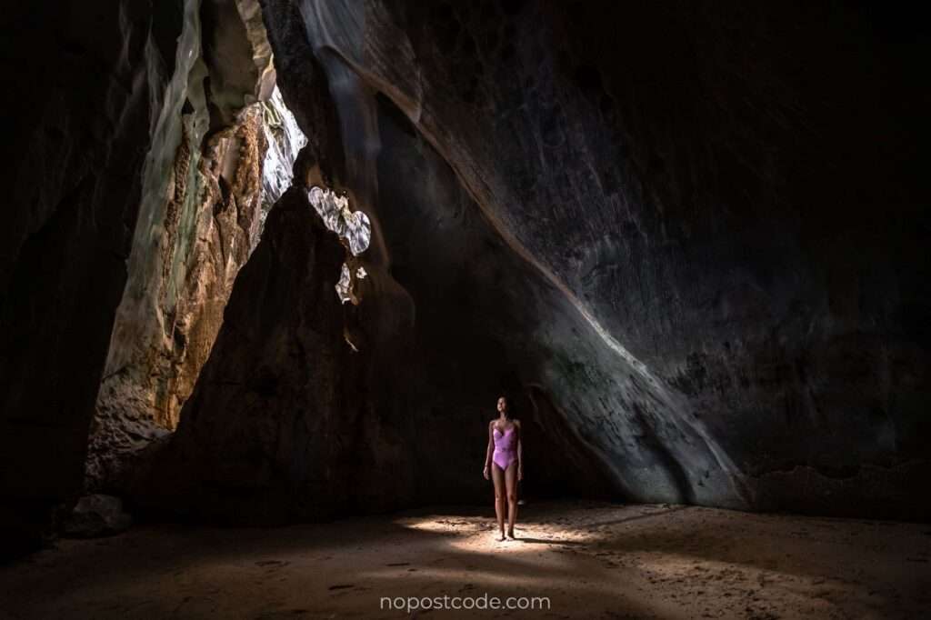 Visitors exploring the limestone chambers of Cudugnon Cave, El Nido