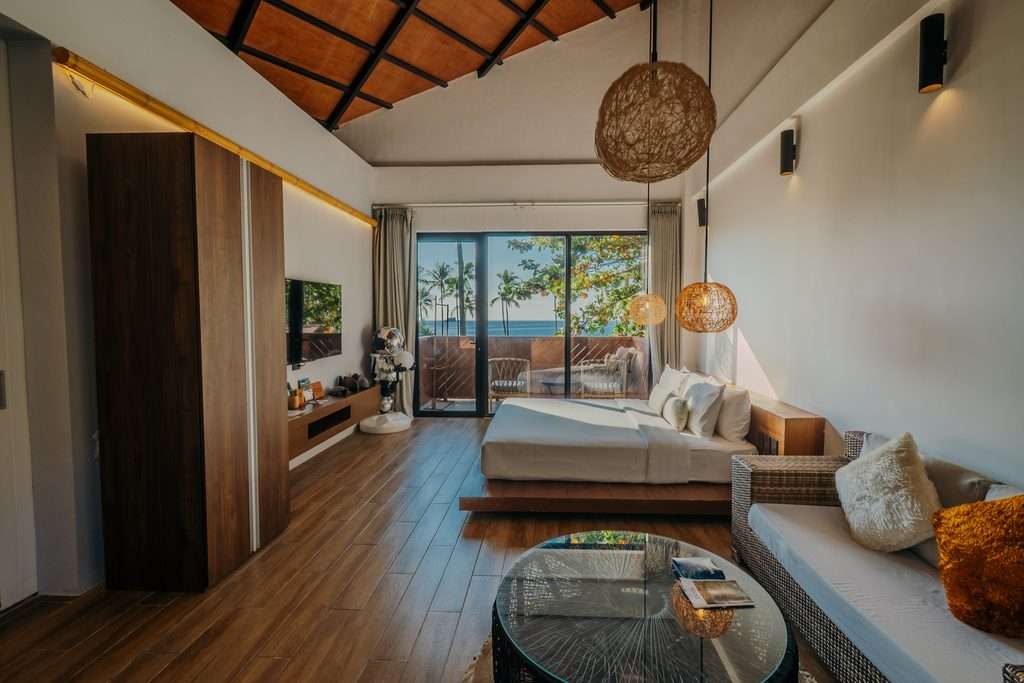 Private Ocean View Room at Nacpan Beach Resort with floor-to-ceiling glass opening to a balcony