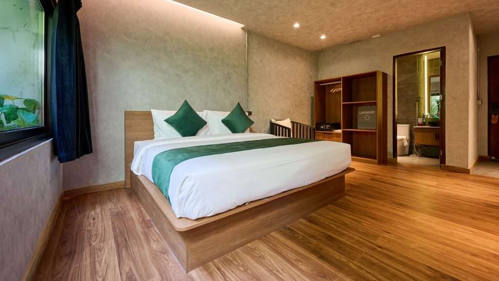 Superior King Room at Z Garden Hotel El Nido with timber floors and a window onto the planting